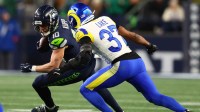 Seattle Seahawks wide receiver Cooper Kupp (10) runs against Los Angeles Rams safety Quentin Lake (37) during the second half in the 2026 NFC Championship Game at Lumen Field.