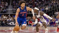 Sacramento Kings guard Dennis Schroder (17) defends against Detroit Pistons guard Cade Cunningham (2) during the during the second half at Little Caesars Arena.