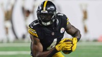 Pittsburgh Steelers wide receiver DK Metcalf (4) runs with the ball against the Cincinnati Bengals during the fourth quarter at Paycor Stadium.
