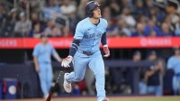 Toronto Blue Jays center fielder Dalton Varsho (5) runs to first base after hitting a two-run home run against the Boston Red Sox during the sixth inning at Rogers Centre.