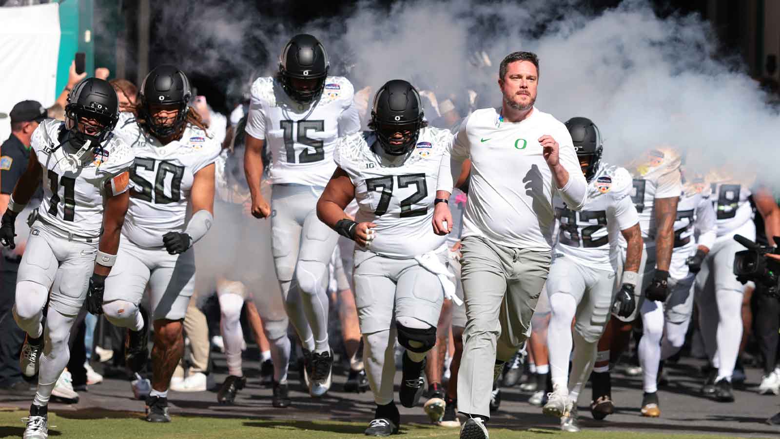 Oregon Ducks head coach Dan Lanning leads his team onto the field prior to the 2025 Orange Bowl and quarterfinal game of the College Football Playoff against the Texas Tech Red Raiders at Hard Rock Stadium.