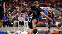 Denver Nuggets guard Bruce Brown (11) and Dallas Mavericks forward Daniel Gafford (21) battle for the loose ball during the second quarter at the American Airlines Center. Mandatory Credit: Jerome Miron-Imagn Images