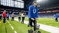 Indianapolis Colts quarterback Daniel Jones moves along the sideline on a scooter Sunday, Dec. 28, 2025, ahead a game against the Jacksonville Jaguars at Lucas Oil Stadium in Indianapolis.