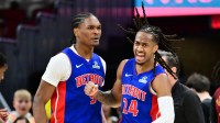 Detroit Pistons guard Ausar Thompson (9) and guard Daniss Jenkins (24) celebrate after a basket against the Cleveland Cavaliers during the second half at Rocket Arena.
