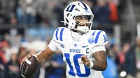 Duke Blue Devils quarterback Darian Mensah (10) looks to throw in the second quarter against the Virginia Cavaliers during the 2025 ACC Championship game at Bank of America Stadium.