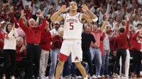 Arkansas Razorbacks guard Darius Acuff Jr (5) gestures after making a three point shot against the Tennessee Volunteers during the second half at Bud Walton Arena.