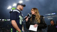 Seattle Seahawks quarterback Sam Darnold (14) is interview by Fox Sports Erin Andrews following an NFC Divisional Round game against the San Francisco 49ers at Lumen Field