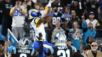 Los Angeles Rams wide receiver Davante Adams (17) makes a catch against the Carolina Panthers in the first half during the NFC Wild Card Round game at Bank of America Stadium.