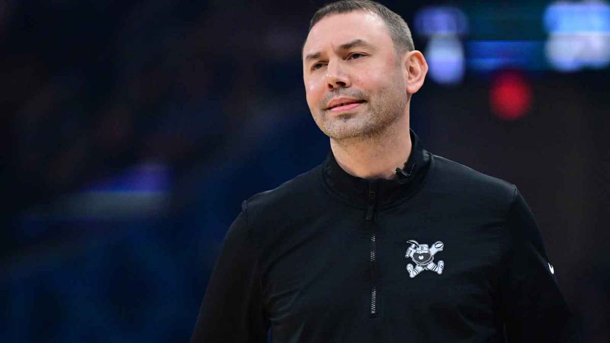 Denver Nuggets head coach David Adelman reacts to a play during the first half against the Cleveland Cavaliers at Rocket Arena.