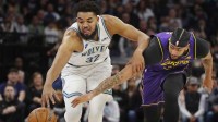 Los Angeles Lakers forward Anthony Davis (3) knocks the ball away from Minnesota Timberwolves forward Karl-Anthony Towns (32) in the first quarter at Target Center