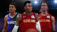 Keon Ellis, Dennis Schroder in Cavs uniforms, and De'Andre Hunter in a Kings uniform in front of the Cavs arena.
