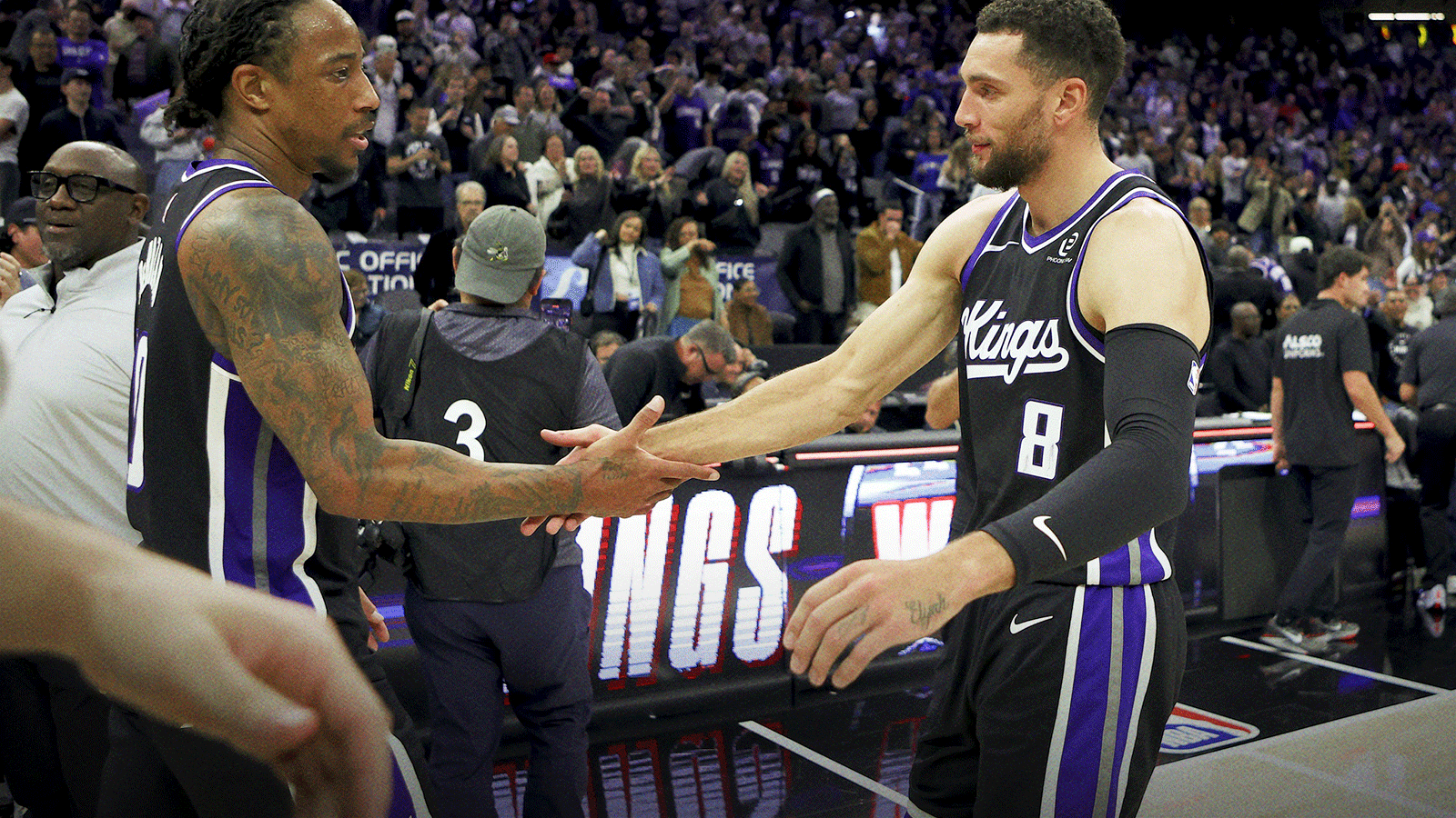 Sacramento Kings forward DeMar DeRozan (10) and guard Zach LaVine (8) celebrate at mid court after defeating the Minnesota Timberwolves at Golden 1 Center. 