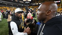 Pittsburgh Steelers head coach Mike Tomlin greets Houston Texans head coach DeMeco Ryans following their AFC Wild Card Round game at Acrisure Stadium.