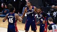 Cleveland Cavaliers center Evan Mobley (4) congratulates guard Donovan Mitchell (45) and guard Darius Garland (10) after the Cavaliers defeated the Denver Nuggets at Rocket Arena.