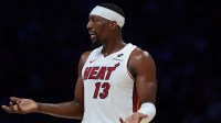 Miami Heat center Bam Adebayo (13) reacts against the Denver Nuggets during the first quarter at Kaseya Center.