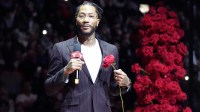 Chicago Bulls and New York Knicks former player Derrick Rose speaks as he is honored at halftime of a game between the Chicago Bulls and the New York Knicks at United Center.