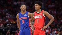Detroit Pistons guard Ausar Thompson (9) and twin brother Houston Rockets guard Amen Thompson (1) stand on the court during the third quarter at Toyota Center.