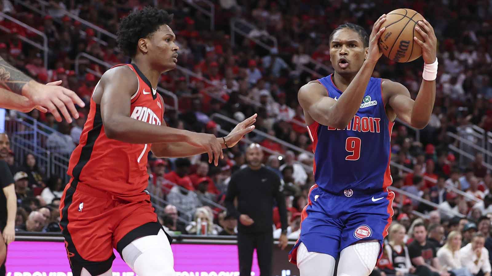 Detroit Pistons guard Ausar Thompson (9) controls the ball as Houston Rockets guard Amen Thompson (1) defends during the third quarter at Toyota Center.