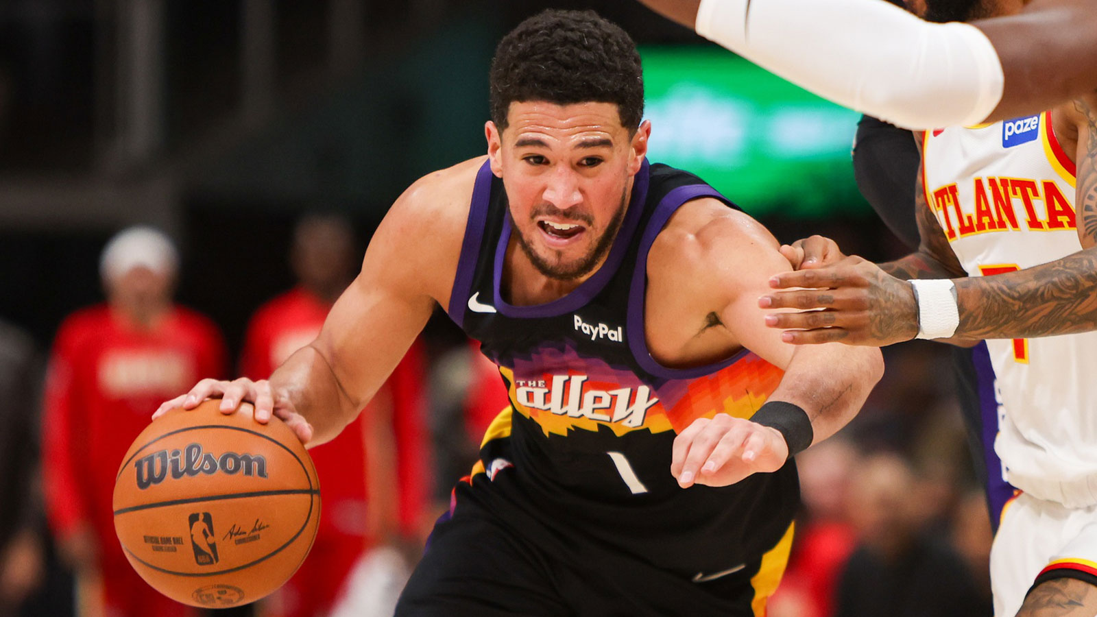 Suns’ Devin Booker out least 1 week with ankle sprain