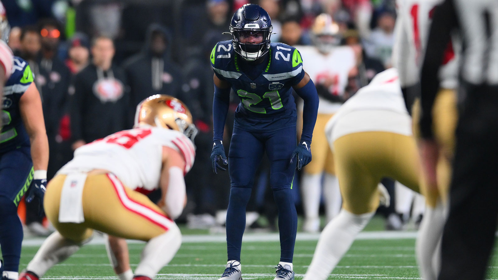 Seattle Seahawks cornerback Devon Witherspoon (21) in his pre-snap stance against the San Francisco 49ers during the first half in an NFC Divisional Round game at Lumen Field.