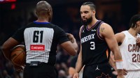 Phoenix Suns forward Dillon Brooks (3) talks with referee Courtney Kirkland (61) during the first half against the Cleveland Cavaliers at Rocket Arena.