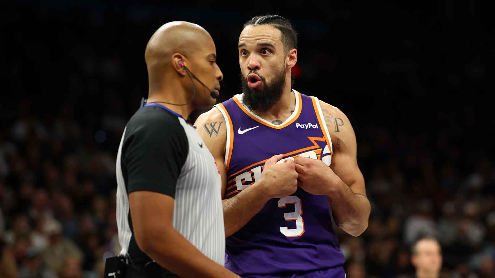 Phoenix Suns forward Dillon Brooks (3) talks to a referee against the Brooklyn Nets in the second half at Mortgage Matchup Center.