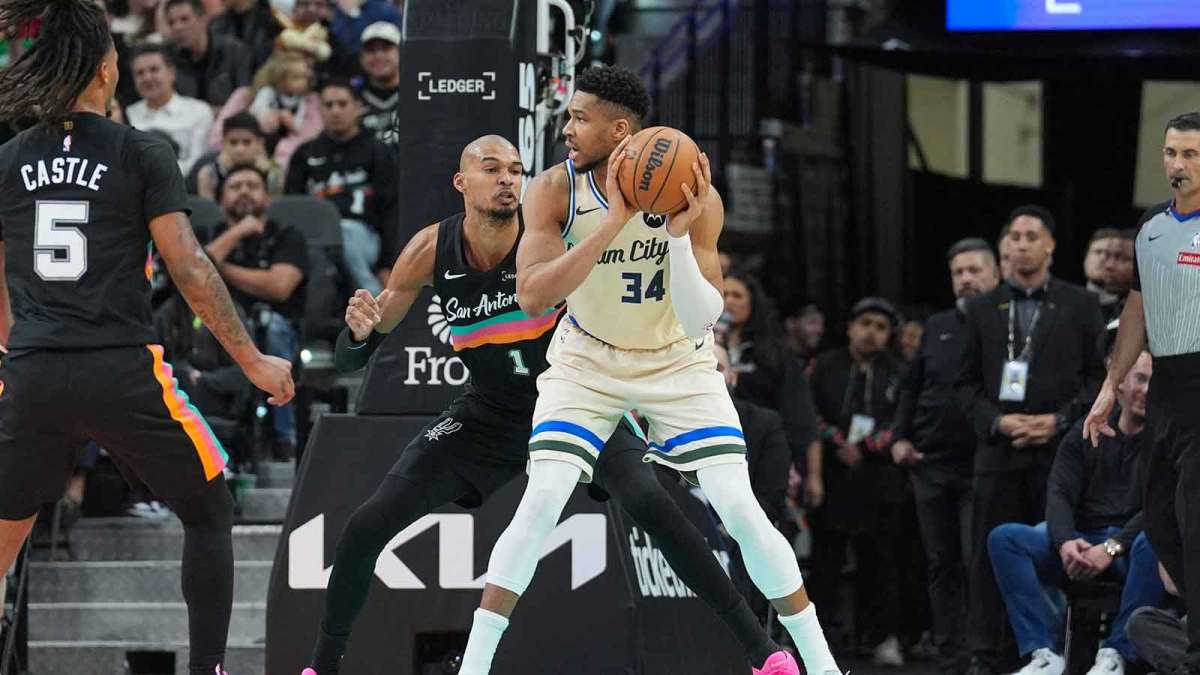 Milwaukee Bucks forward Giannis Antetokounmpo (34) backs up against San Antonio Spurs forward/center Victor Wembanyama (1) in the first half at Frost Bank Center.