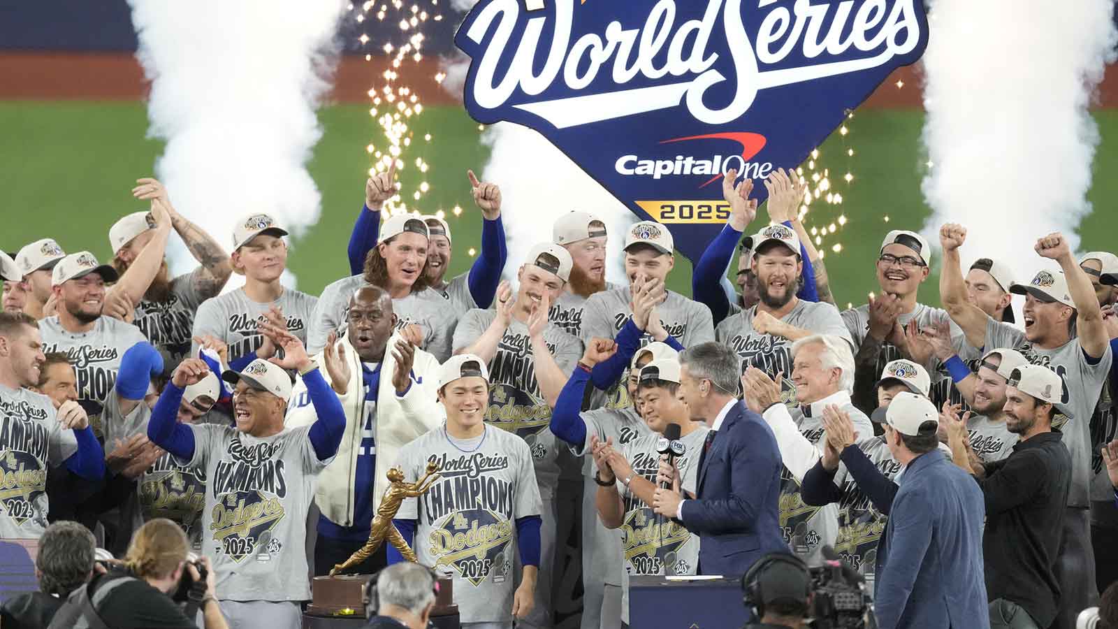 The Los Angeles Dodgers celebrate on the podium after defeating the Toronto Blue Jays in game seven of the 2025 MLB World Series at Rogers Centre.