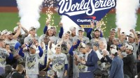 The Los Angeles Dodgers celebrate on the podium after defeating the Toronto Blue Jays in game seven of the 2025 MLB World Series at Rogers Centre.