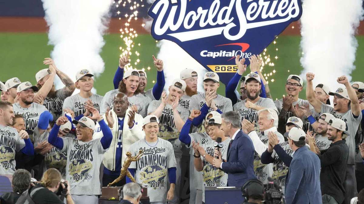 The Los Angeles Dodgers celebrate on the podium after defeating the Toronto Blue Jays in game seven of the 2025 MLB World Series at Rogers Centre.