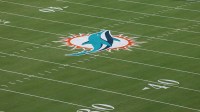 The Miami Dolphins logo is seen at midfield prior to a game against the Baltimore Ravens at Hard Rock Stadium.
