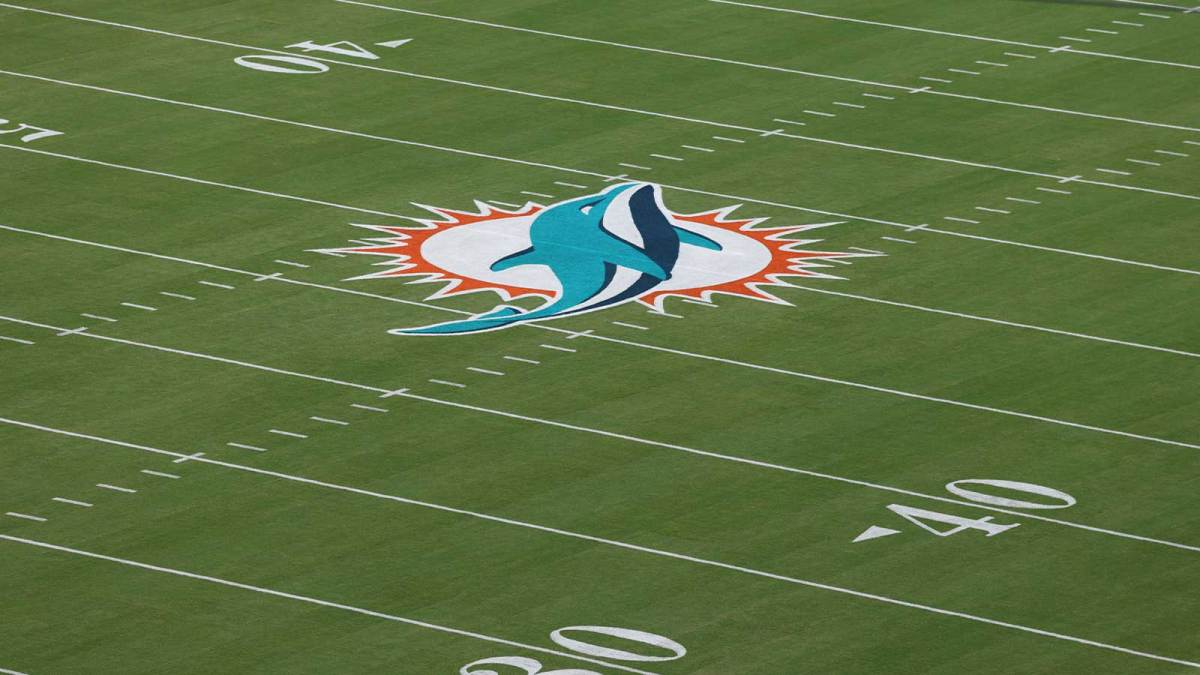 The Miami Dolphins logo is seen at midfield prior to a game against the Baltimore Ravens at Hard Rock Stadium.