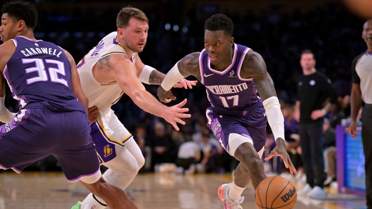Sacramento Kings guard Dennis Schroder (17) drives past Los Angeles Lakers guard Luka Doncic (77) in the first half at Crypto.com Arena.