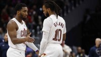 Cleveland Cavaliers guard Donovan Mitchell (45) celebrates with Cavaliers guard Darius Garland (10) against the Washington Wizards in the second half at Capital One Arena.