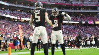 Atlanta Falcons tight end Kyle Pitts Sr. (8) reacts with wide receiver Drake London (5) after catching a touchdown against the Arizona Cardinals during the first half at State Farm Stadium.