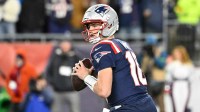 New England Patriots quarterback Drake Maye (10) looks to pass Los Angeles Chargers during the second half in an AFC Wild Card Round game at Gillette Stadium.