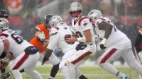 New England Patriots quarterback Drake Maye (10) drops back to pass against the Denver Broncos during the second half in the 2026 AFC Championship Game at Empower Field at Mile High.