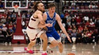 Duke Blue Devils guard Nikolas Khamenia (14) dribbles against Stanford Cardinal guard Jeremy Dent-Smith (25) in the second half at Maples Pavilion.