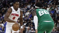 Detroit Pistons center Jalen Duren (0) dribbles the ball against Boston Celtics center Neemias Queta (88) in the second half at Little Caesars Arena.