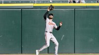 Baltimore Orioles outfielder Dylan Carlson (15) catches a final out hit by Chicago White Sox shortstop Colson Montgomery during the ninth inning at Rate Field.