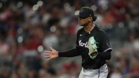 Miami Marlins starting pitcher Edward Cabrera (27) reacts to his eleventh strikeout against the Atlanta Braves during the eighth inning at Truist Park.