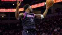Minnesota Timberwolves guard Anthony Edwards (5) secures a rebound in the fourth quarter against the Golden State Warriors at Target Center.