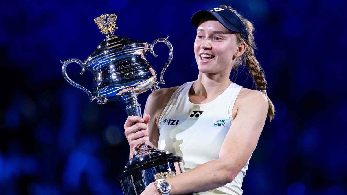 Jan 31, 2026; Melbourne, Victoria, Australia; Elena Rybakina of Kazakhstan with the Daphne Akhurst Memorial Cup after her victory over Aryna Sabalenka in the final of the womenís singles at the Australian Open at Rod Laver Arena in Melbourne Park. Mandatory Credit: Mike Frey-Imagn Images