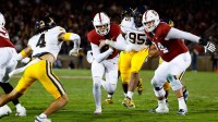 Stanford Cardinal quarterback Elijah Brown (2) runs with the ball against California Golden Bears defensive back Brent Austin (4) during the fourth quarter at Stanford Stadium.