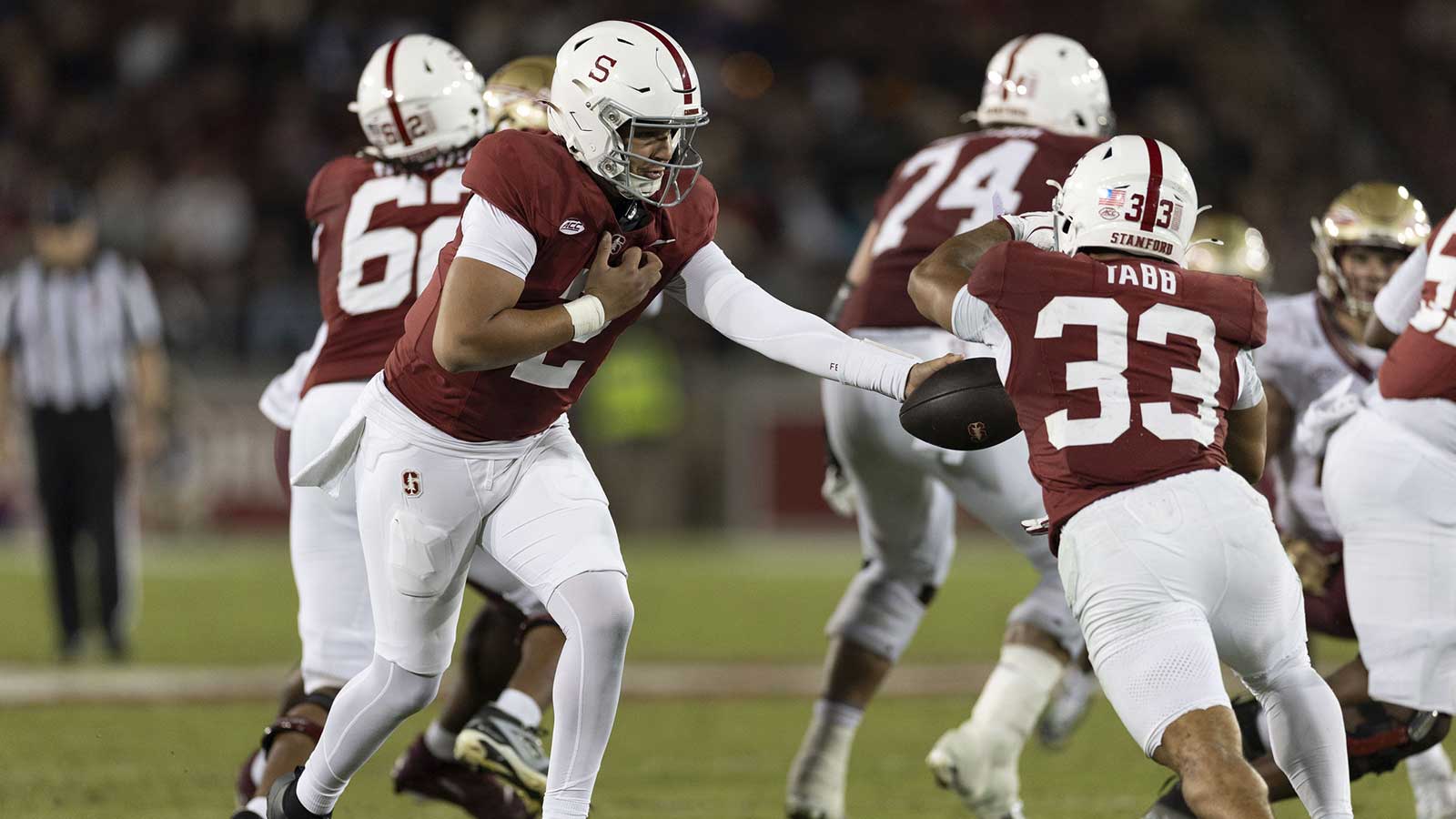 Stanford Cardinal quarterback Elijah Brown (2) hands the ball off to Stanford Cardinal running back Cole Tabb (33) during the third quarter against the Florida State Seminoles at Stanford Stadium.
