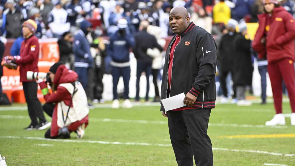Washington Commanders offensive coordinator Eric Bieniemy on the field before the game against the Dallas Cowboys at FedExField.