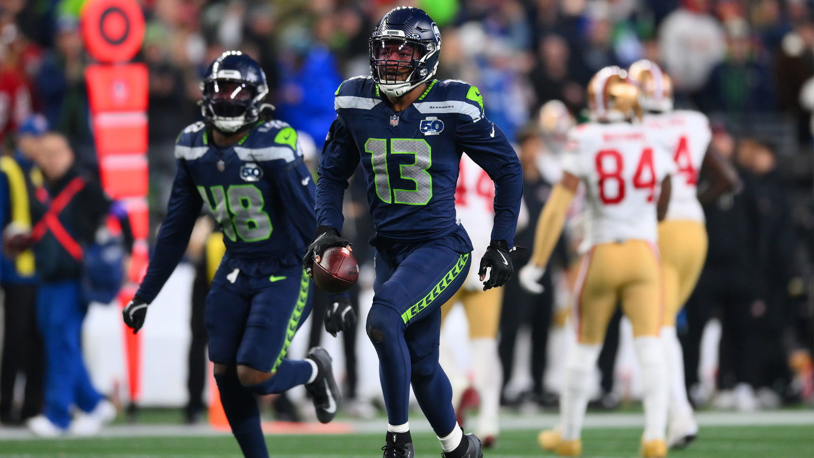 Seattle Seahawks linebacker Ernest Jones IV (13) reacts after an interception against the San Francisco 49ers during the second half in an NFC Divisional Round game at Lumen Field. 
