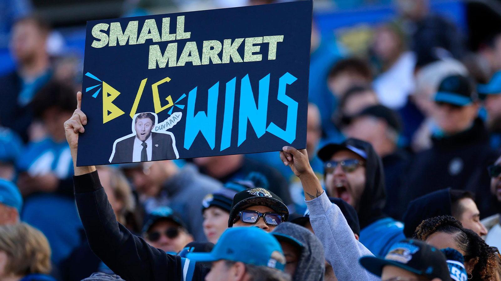 A Jacksonville Jaguars fan holds up a sign during the second quarter of an NFL football matchup at EverBank Stadium, Sunday, Jan. 4, 2026, in Jacksonville, Fla. The Jaguars defeated the Titans 41-7, capturing the AFC North title.