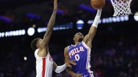 Philadelphia 76ers guard Tyrese Maxey (0) drives for a dunk against Houston Rockets forward Jabari Smith Jr. (10) during the second quarter at Xfinity Mobile Arena.