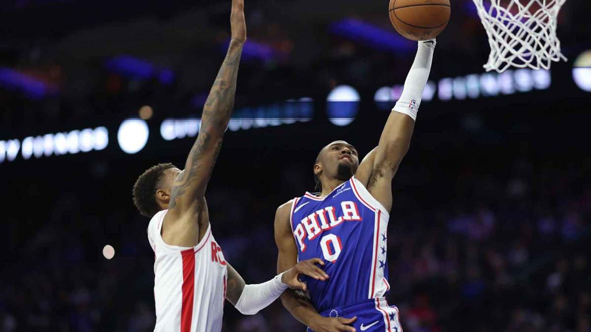 Philadelphia 76ers guard Tyrese Maxey (0) drives for a dunk against Houston Rockets forward Jabari Smith Jr. (10) during the second quarter at Xfinity Mobile Arena.